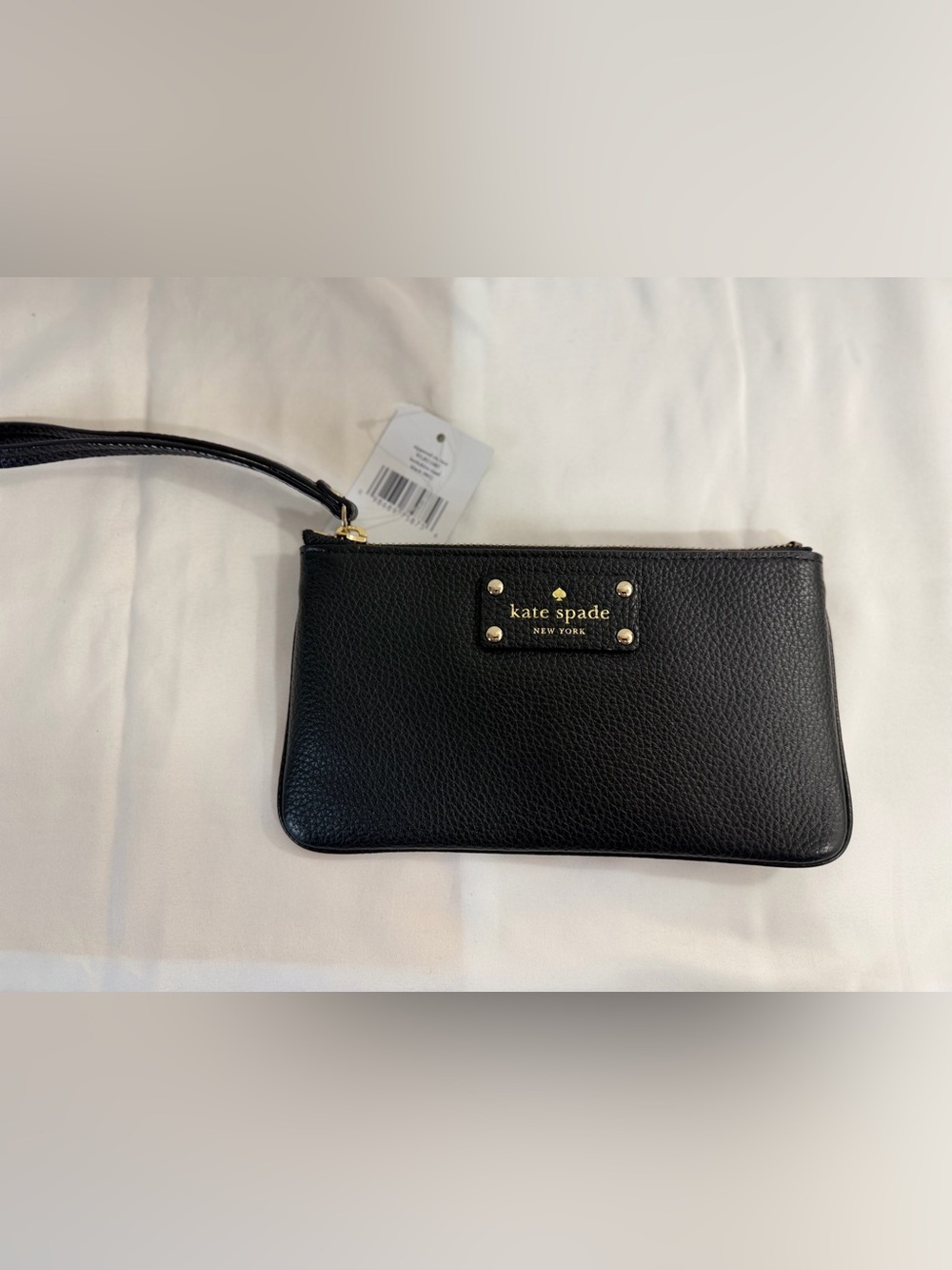 kate spade Black Pebbled Leather Wristlet with Gold Logo Plate